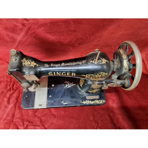 95 - A vintage Singer sewing machine.