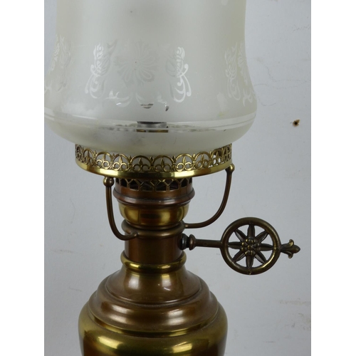 14 - A vintage brass oil lamp and shade converted to electric.