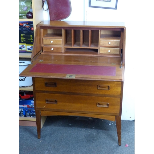 19 - A mid-century teak writing bureau with red leather writing board.