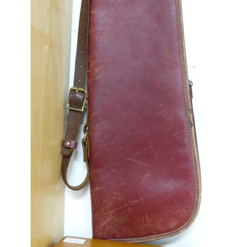 20 - A vintage brown leather, fleece lined gun slip/ shoulder bag.