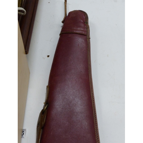 20 - A vintage brown leather, fleece lined gun slip/ shoulder bag.