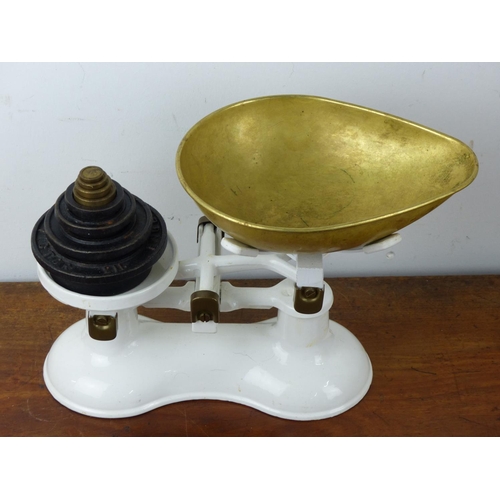 22 - A set of white enamel scales complete with Victor weights.