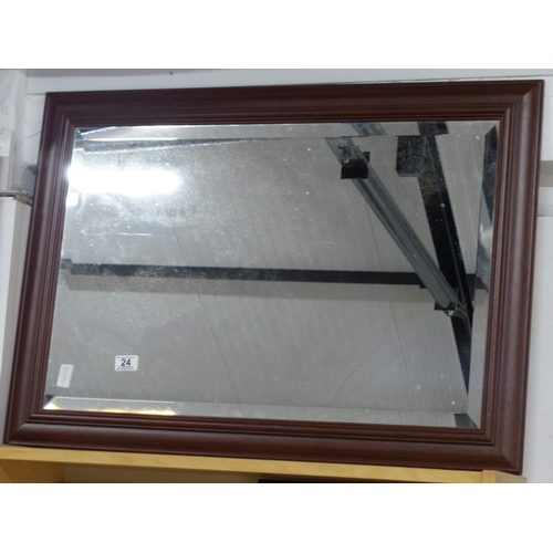 24 - A large wood framed bevelled glass mirror.