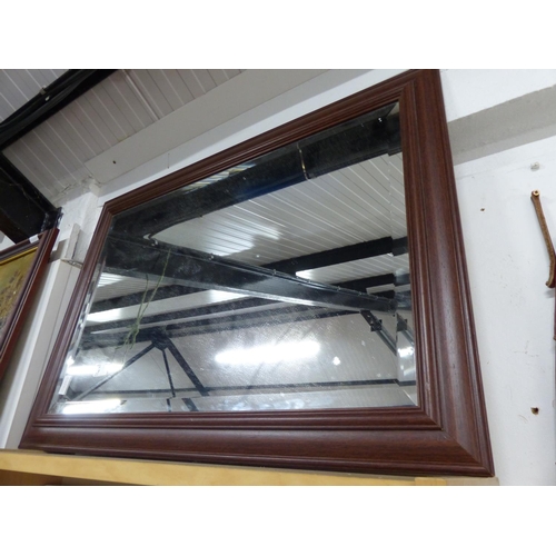 24 - A large wood framed bevelled glass mirror.