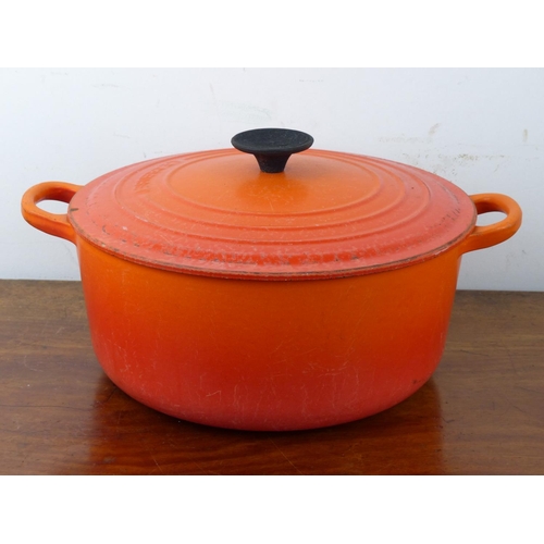 29 - A vintage Le Cresuset 26 D1 orange enamel cooking pot.