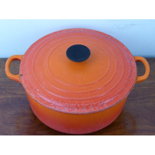 29 - A vintage Le Cresuset 26 D1 orange enamel cooking pot.