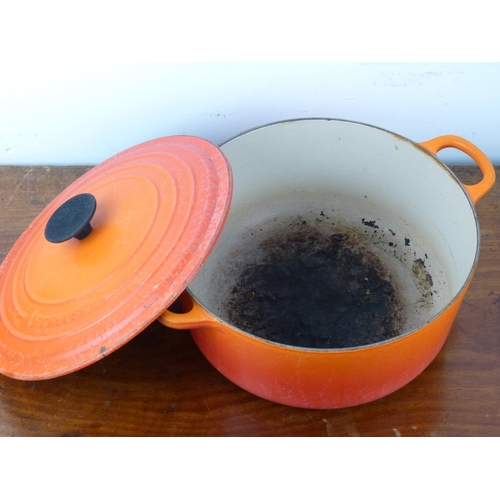 29 - A vintage Le Cresuset 26 D1 orange enamel cooking pot.