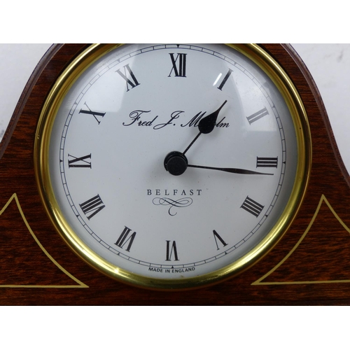 35 - An antique style mantle clock, Fred J. Malcolm - Belfast - Made in England.