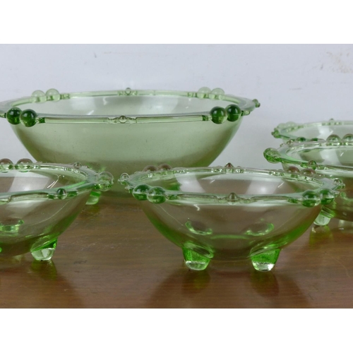 36 - A collection of 1930s green glass dessert bowls.