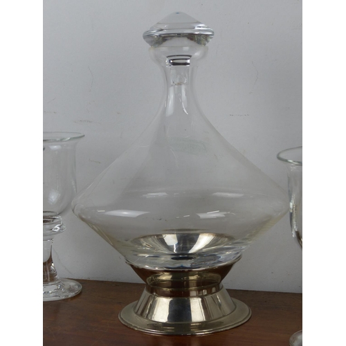 38 - A vintage glass carafe / decanter with conical base on silver plate stand accompanied by a stunning ... 