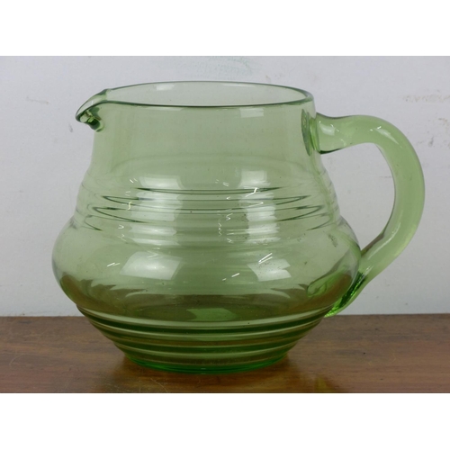 39 - A stunning depression era uranium glass pitcher.