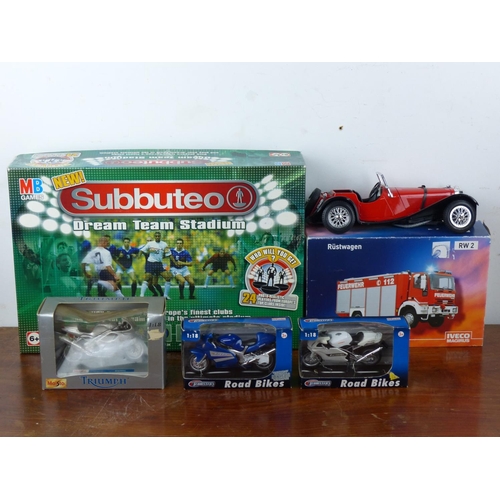 45 - An assortment of model motorbikes, cars and a Subbuteo board game.