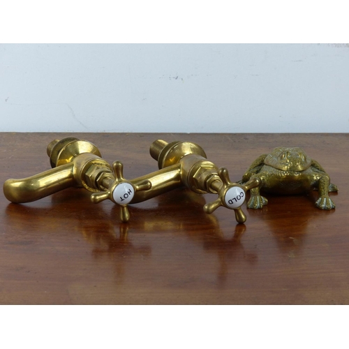 9 - An assortment of vintage brass items to include a frog match holder, a pair of 'hot' and 'cold' fauc... 