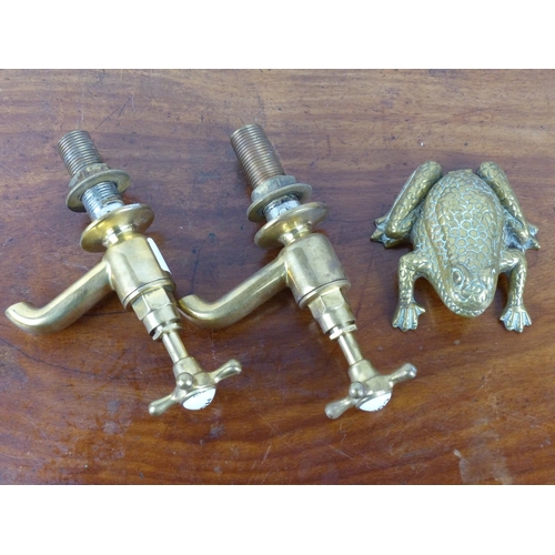 9 - An assortment of vintage brass items to include a frog match holder, a pair of 'hot' and 'cold' fauc... 