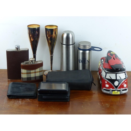 105 - An assortment of items to include hip flasks, silver plated champagne flutes & more.