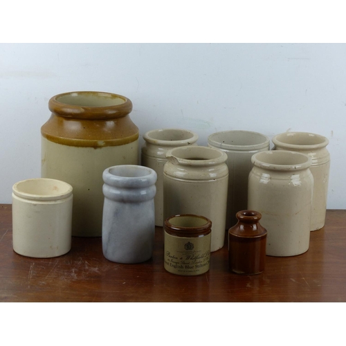 106 - A collection of antique stoneware jars.