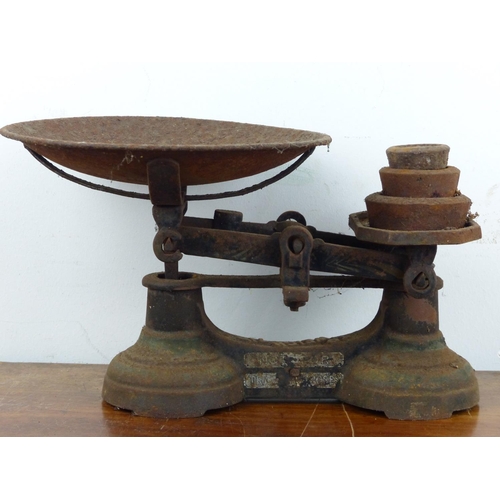 126 - A set of antique scales with weights.