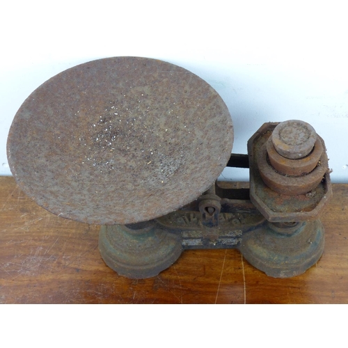 126 - A set of antique scales with weights.