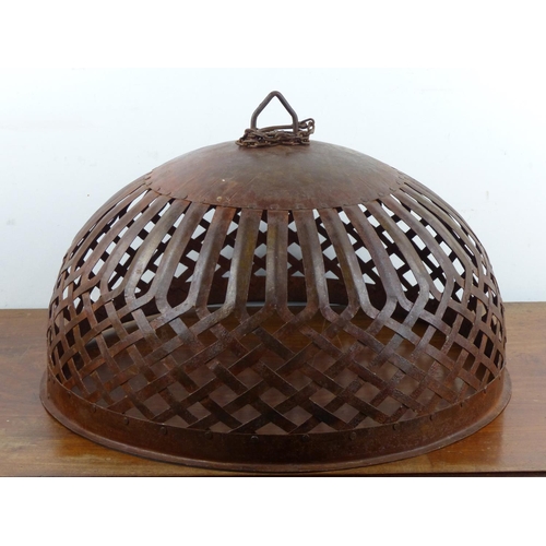 204 - A large decorative metal lamp shade, measuring 48cm wide.