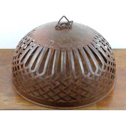 204 - A large decorative metal lamp shade, measuring 48cm wide.