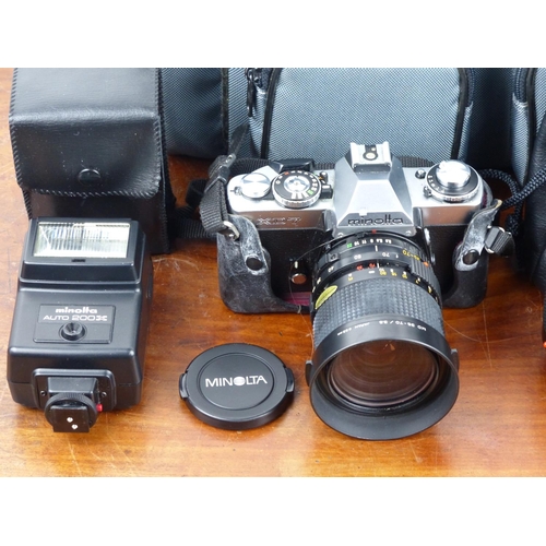 221 - A vintage Minolta XD7 camera, with various lenses & accessories.