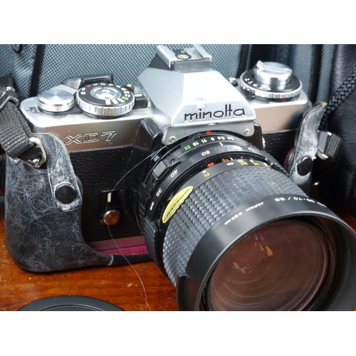 221 - A vintage Minolta XD7 camera, with various lenses & accessories.