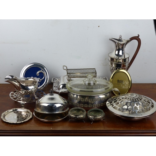 230 - A collection of silver plated items to include claret jug & more.