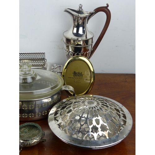 230 - A collection of silver plated items to include claret jug & more.