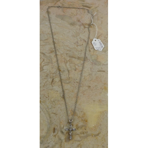 237 - A sterling silver cross pendant with chain.