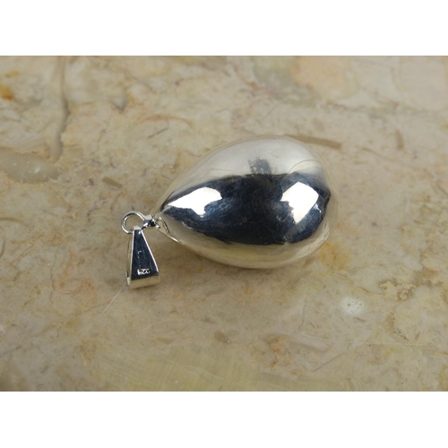 241 - A large sterling silver 'drop' pendant. Weighing 7.60 grams.