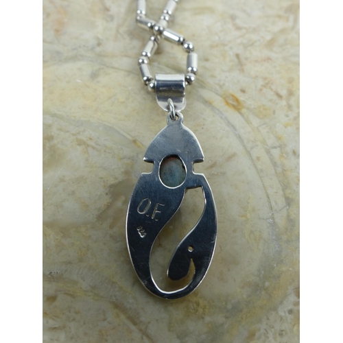 243 - A decorative sterling silver pendant & chain. Weighing 20.64 grams.