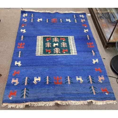 152 - A large decorative rug, measures 170cm x 245cm