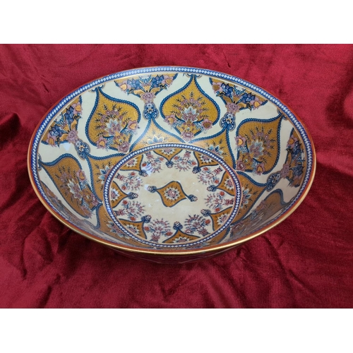 167 - A large decorative bowl, measuring 35cm wide.