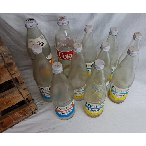 176 - A vintage wooden Maine Soft Drinks Ballymoney crate & assortment of bottles.