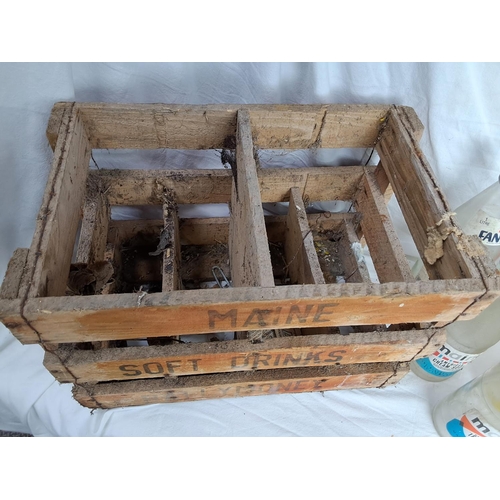 176 - A vintage wooden Maine Soft Drinks Ballymoney crate & assortment of bottles.