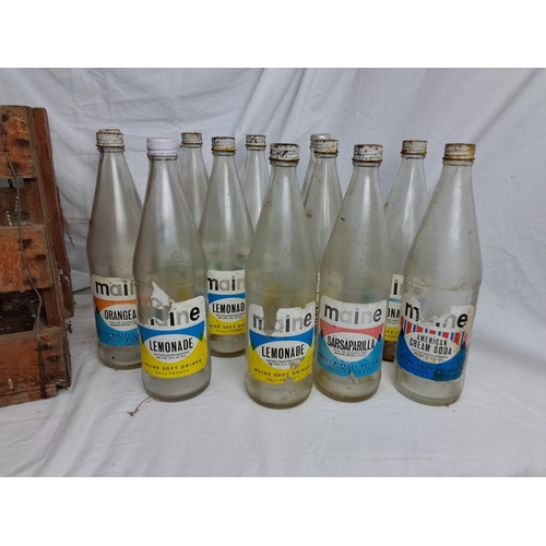 177 - A vintage wooden Maine Soft Drinks Ballymoney crate & assortment of bottles.