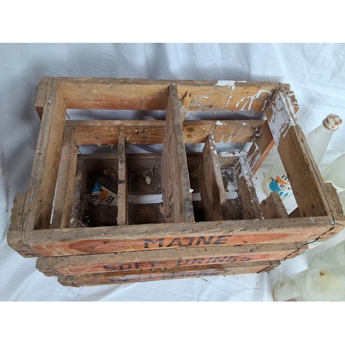 177 - A vintage wooden Maine Soft Drinks Ballymoney crate & assortment of bottles.