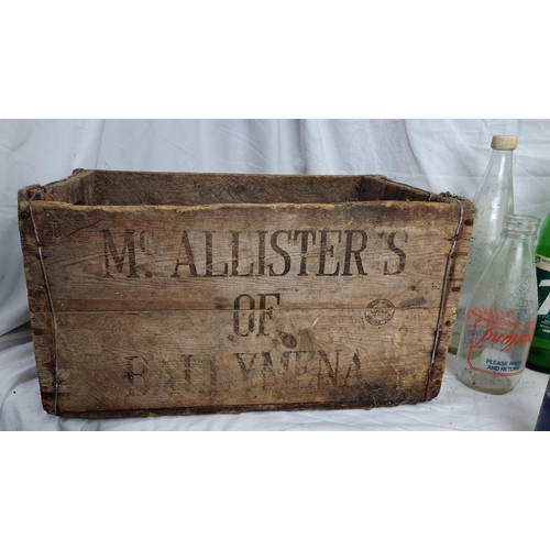 178 - A vintage wooden McAllisters of Ballymena crate & assortment of bottles.