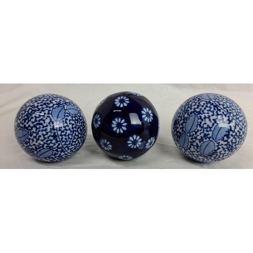 185 - A set of 3 decorative ceramic balls.