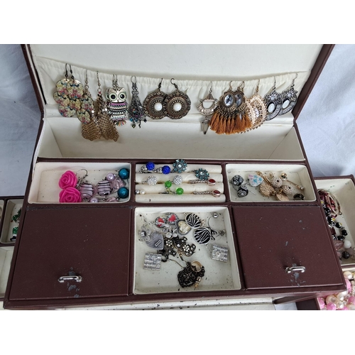 195 - A jewellery box with contents.