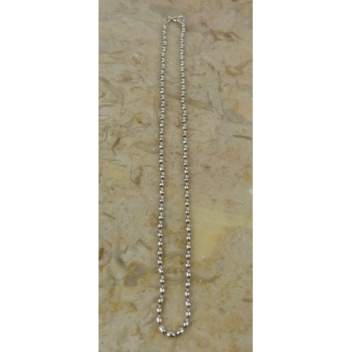 262 - A Sterling Silver beaded necklace. .431 grams.