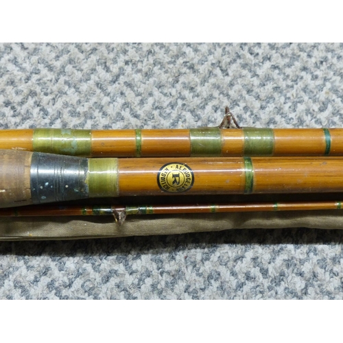 297 - An antique split cane fishing rod.