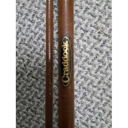 300 - A vintage Craddock fishing rod with reel.