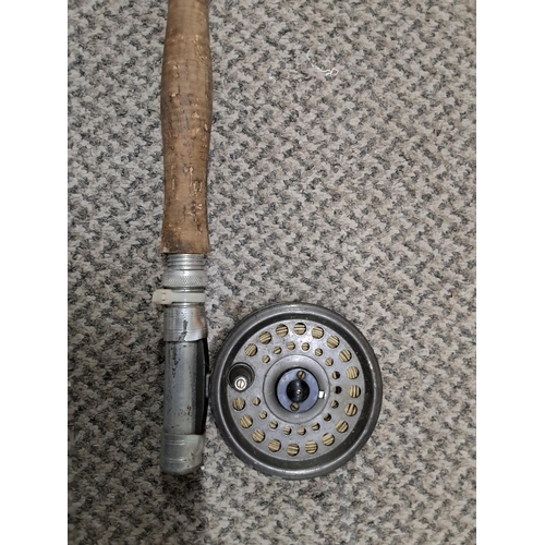 300 - A vintage Craddock fishing rod with reel.