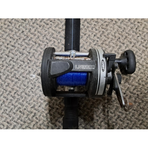 302 - An NGT fishing rod with reel.