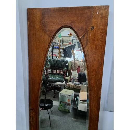 307 - A large wood framed mirror with bevelled glass.