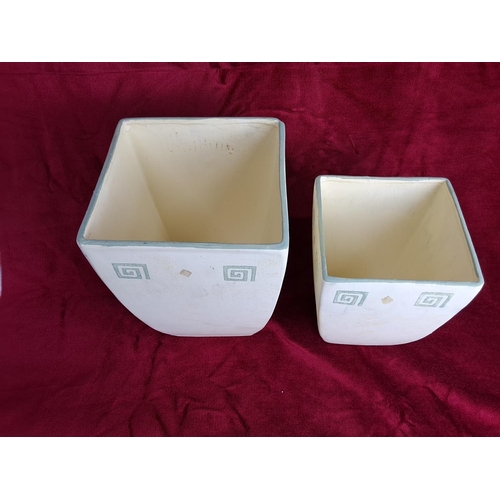 322 - A set of 2 decorative ceramic planters.