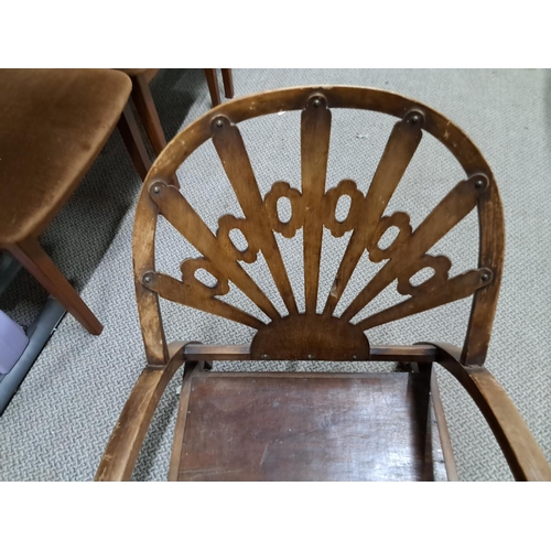 326 - An unusual antique/ art deco fireside chair with decorative back panel.