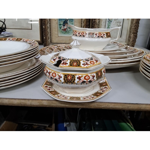 332 - A decorative antique/ vintage dinner service.