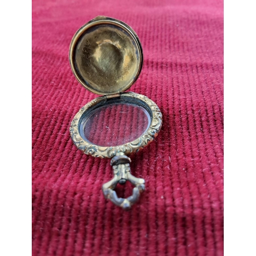 355 - A decorative antique locket.